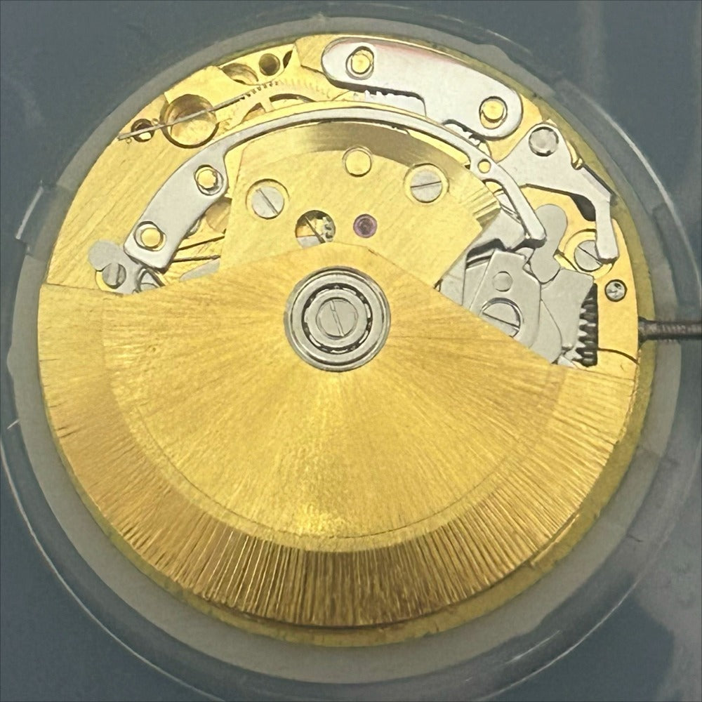 Golden Dandong 7750 mechanical watch movement with small seconds at 3, 6, and 9 o'clock, China made.