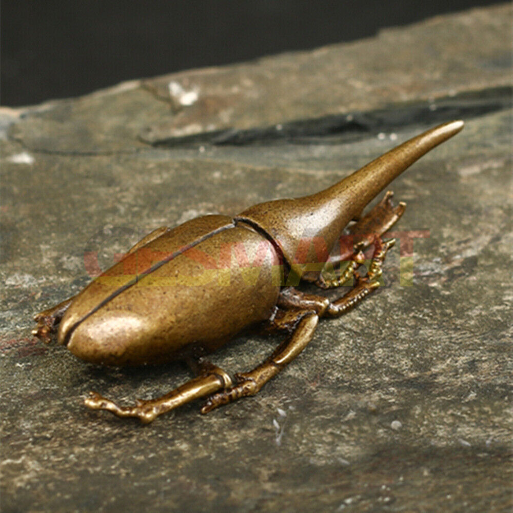 Hand-carved solid copper beetle figurine, detailed bronze insect decor for collectors.