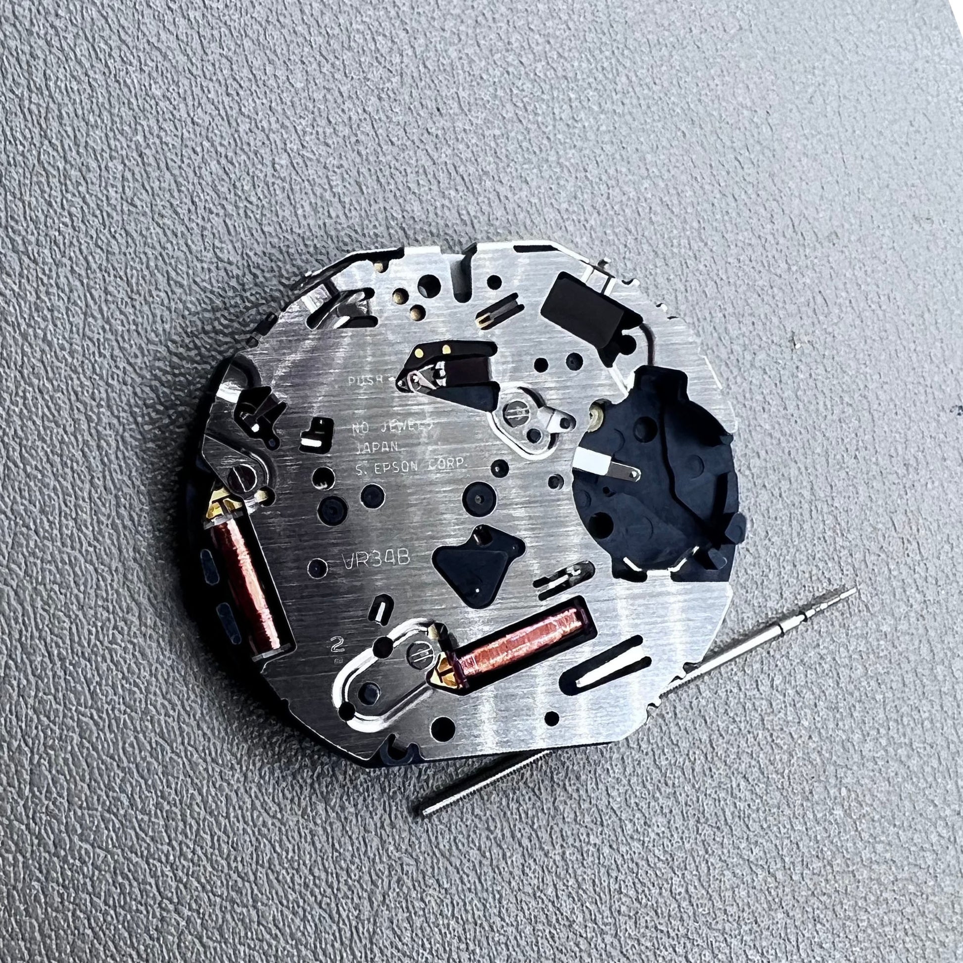 Japan Hattori Epson TMI VR34 quartz watch movement for precise timekeeping in accessories.