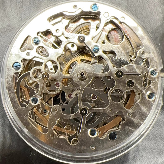 Silver hollow watch part with Hangzhou 2189 automatic movement, China-made for precise mechanical repair.