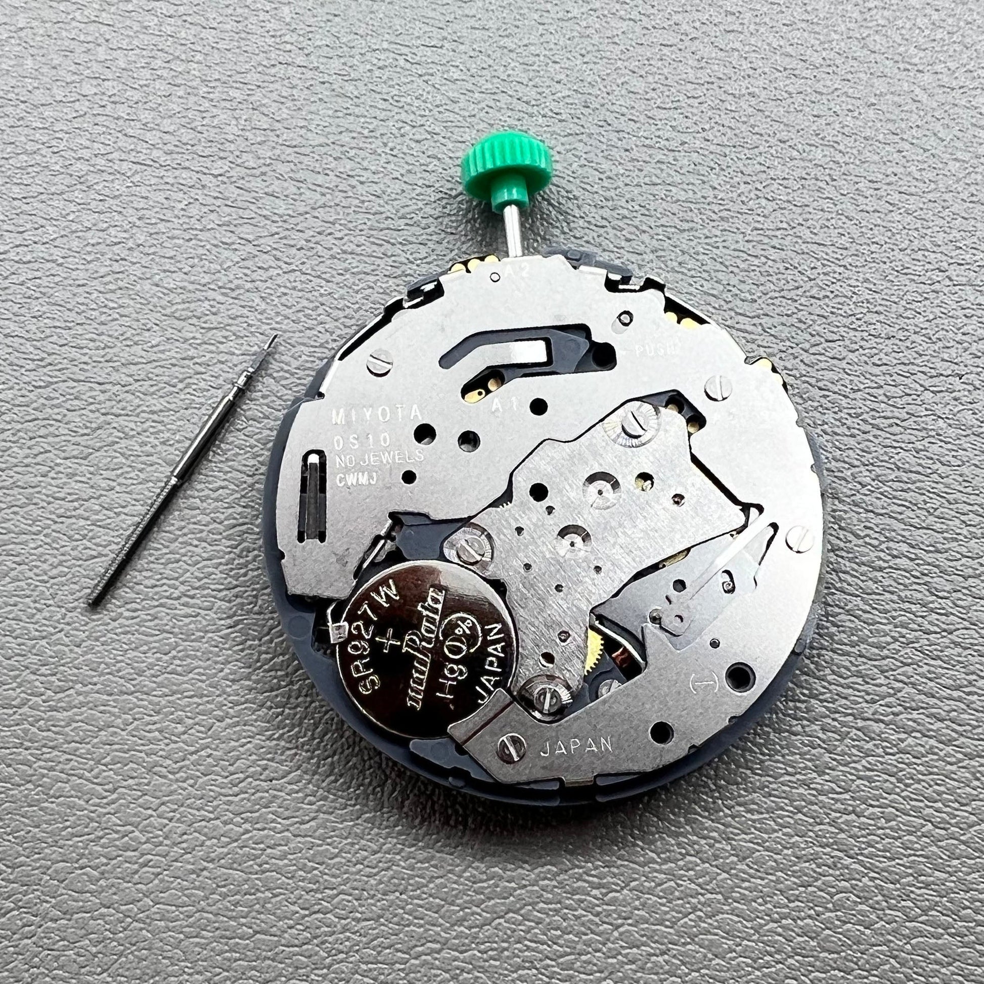 Japan Miyota OS10 quartz watch movement with date display at 3 o'clock, precision timekeeping accessory.