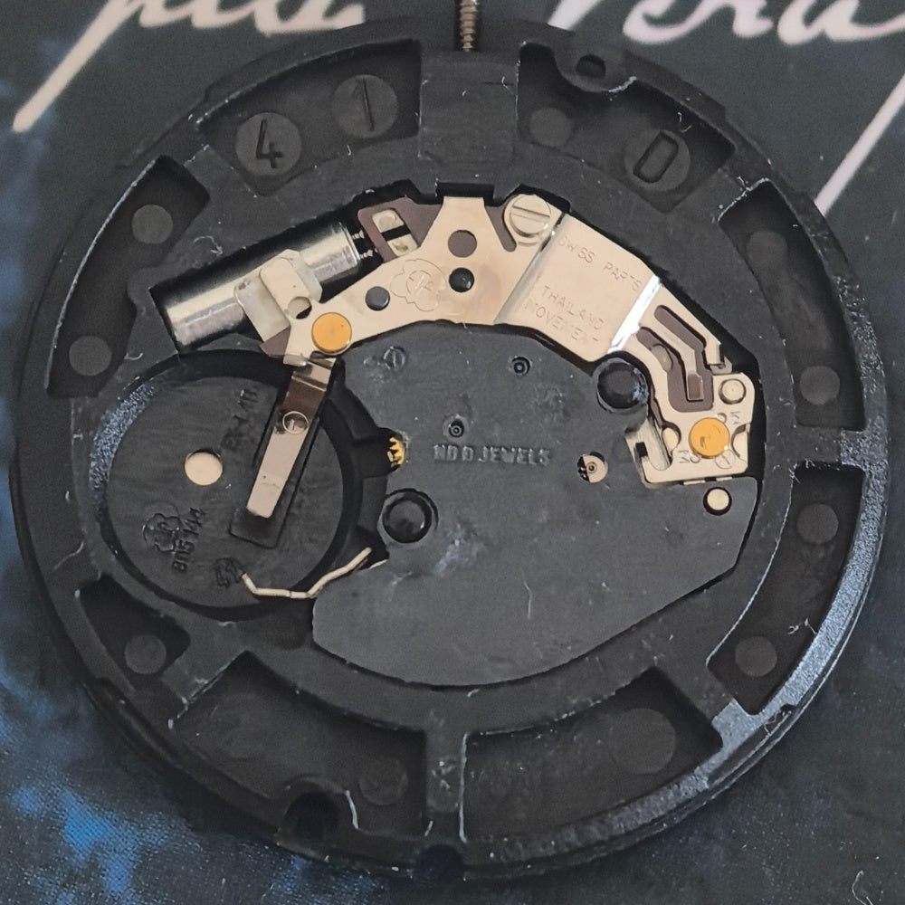 Swiss ETA805.144 quartz movement with golden disk, 3-hand watch part for precise timekeeping.