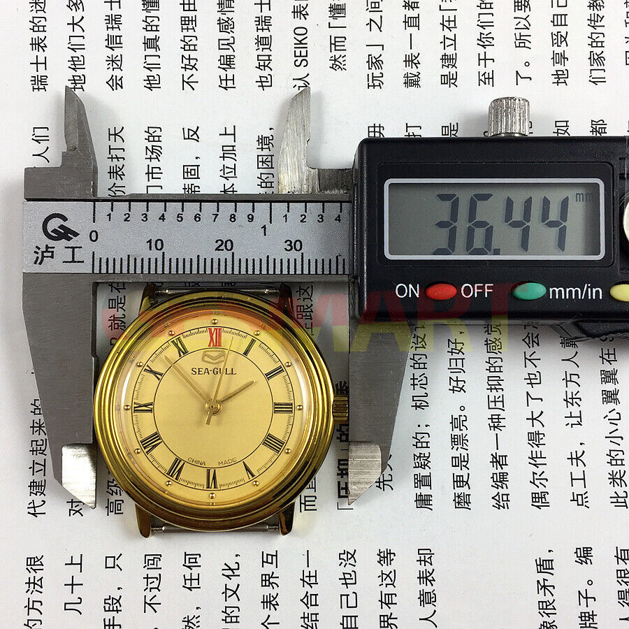 Tianjin Seagull 35mm round gold watch with manual mechanical movement and elegant gold dial for classic style.