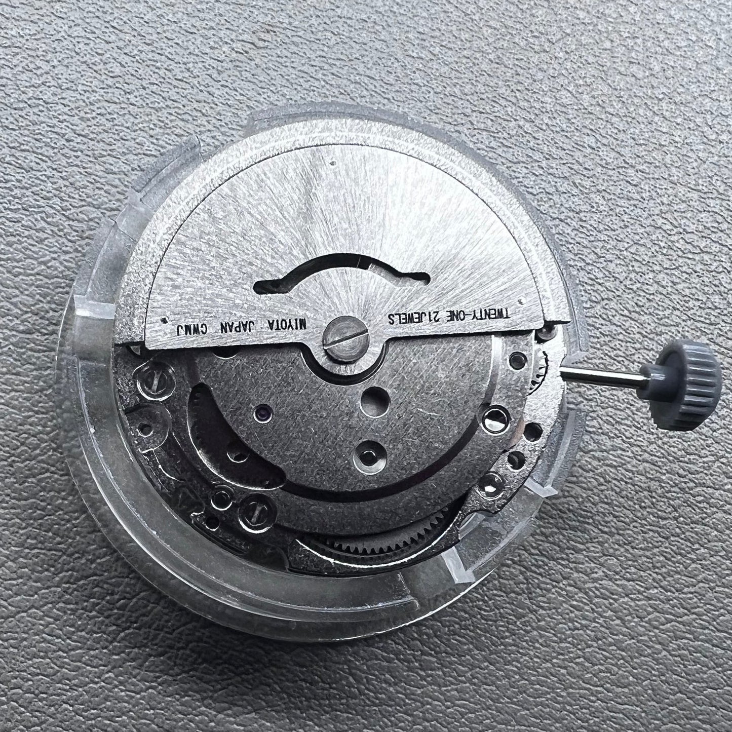 Japan Miyota 8215 automatic watch movement with black dial and date display at 6 o'clock by Miyota.