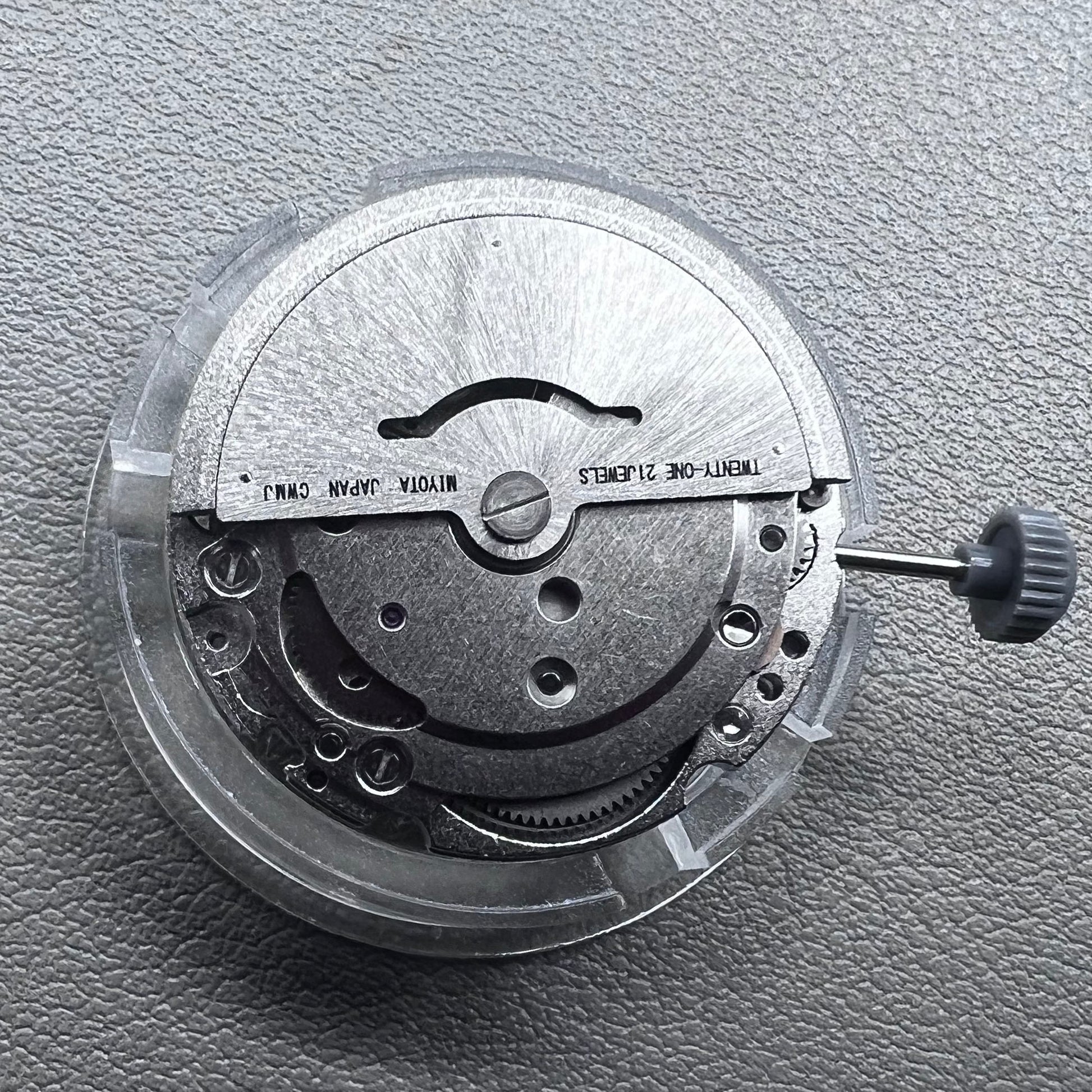 Japan Miyota 8215 automatic watch movement with black dial and date display at 6 o'clock by Miyota.