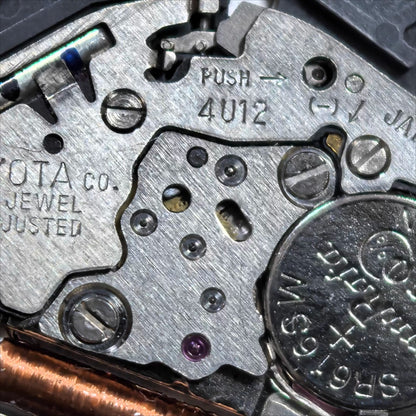 Miyota 4U12 quartz watch movement with single calendar date at 6, Japan-made precision for watch repairs.
