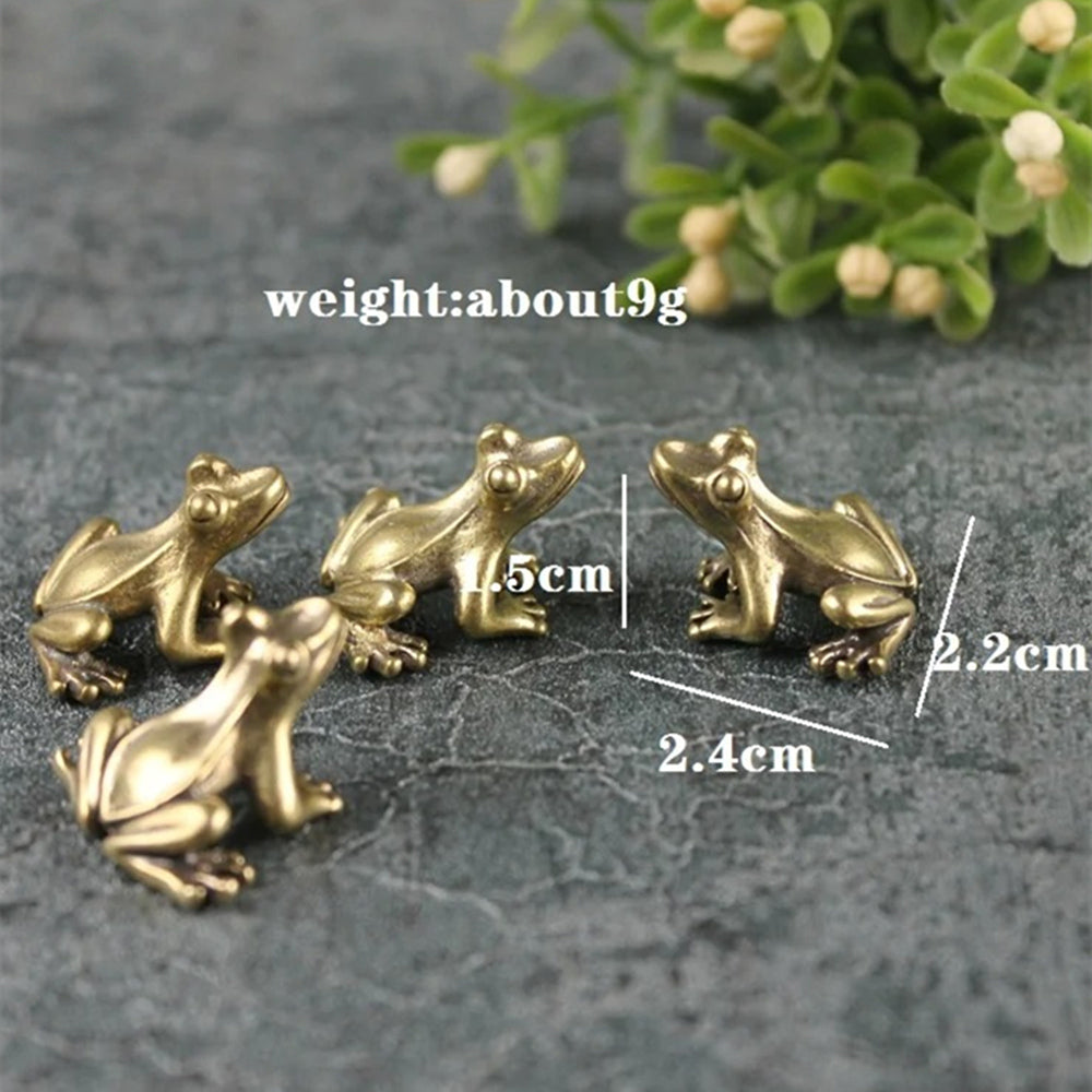 1. Three solid copper vintage frog figurines hand-carved for decor or collectibles.  