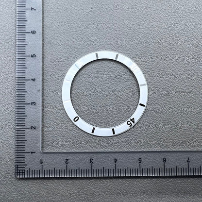 White 36mm ceramic watch bezel insert with numeral markings for men's and women's watches.