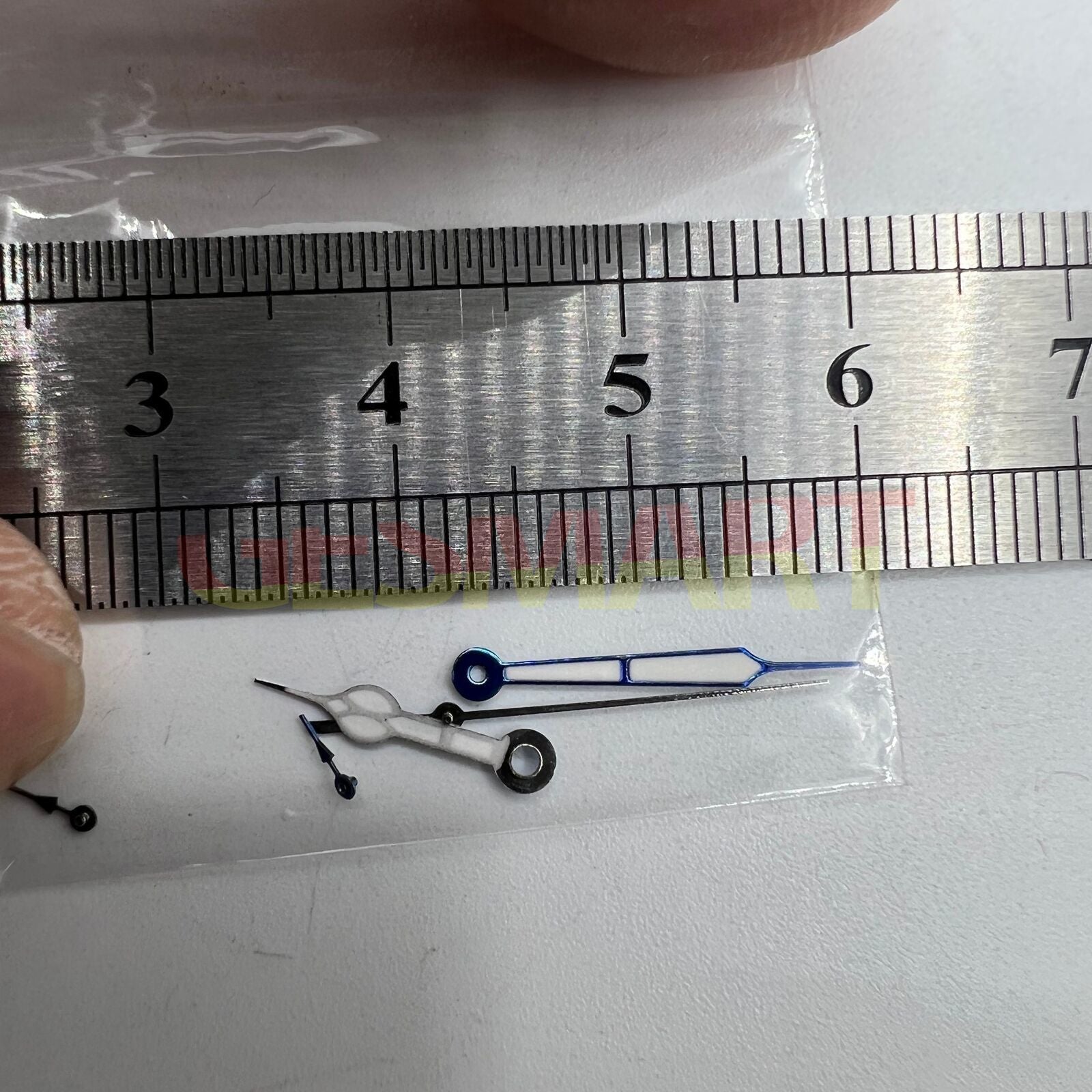 Blue-trimmed green lume watch hands for Miyota OS10 movement, enhancing visibility and style in watch accessories.