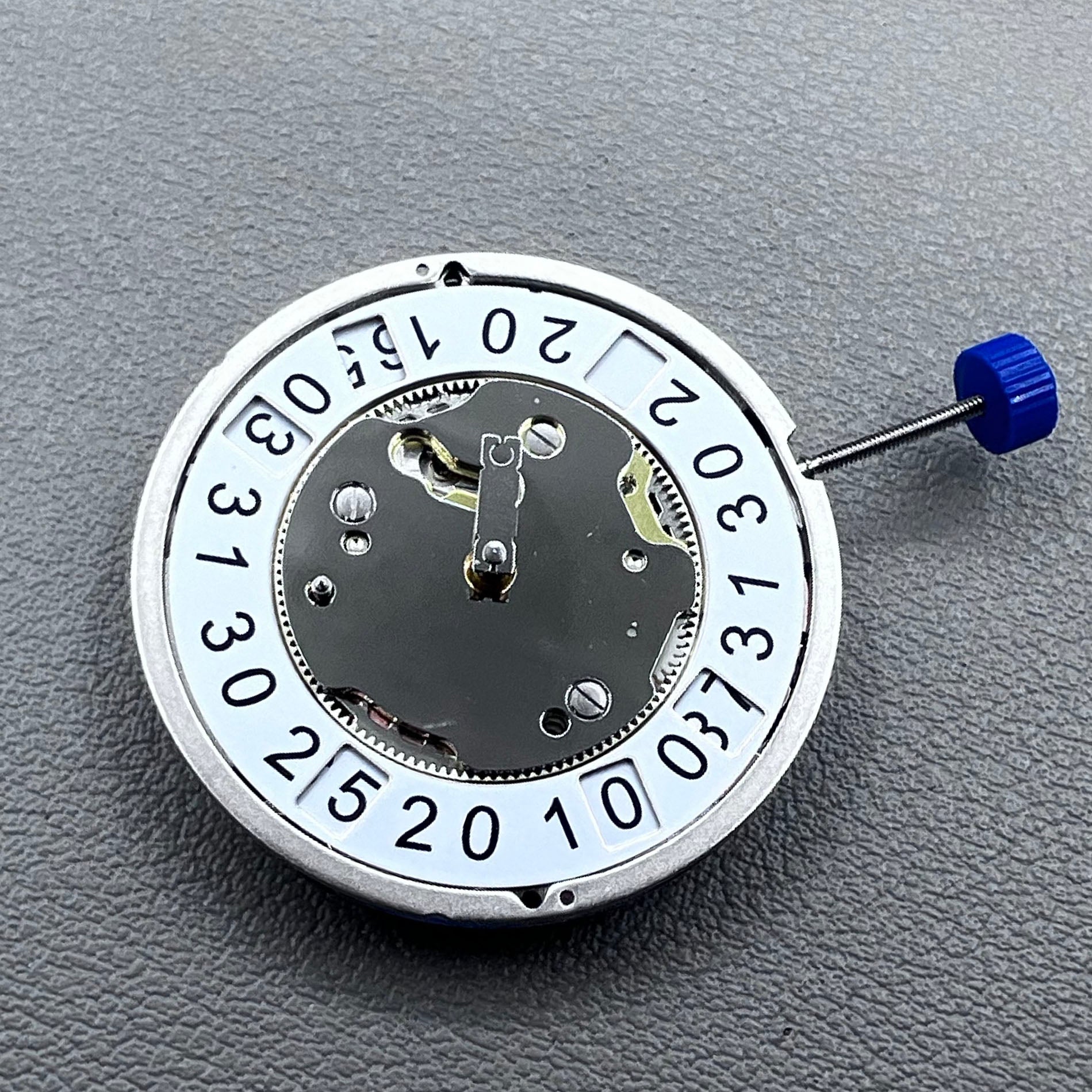 Swiss Ronda 4120B quartz watch movement by Ronda, precise and reliable timekeeping component.
