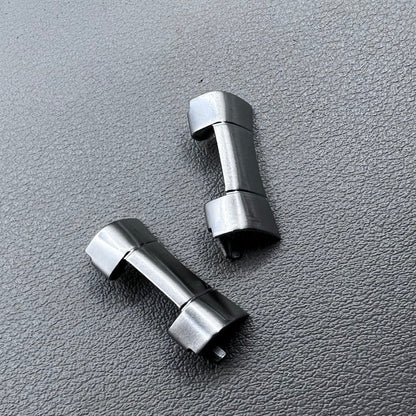Set of 2 polished silver steel curved end links, 20x10mm, for secure watch band attachment.