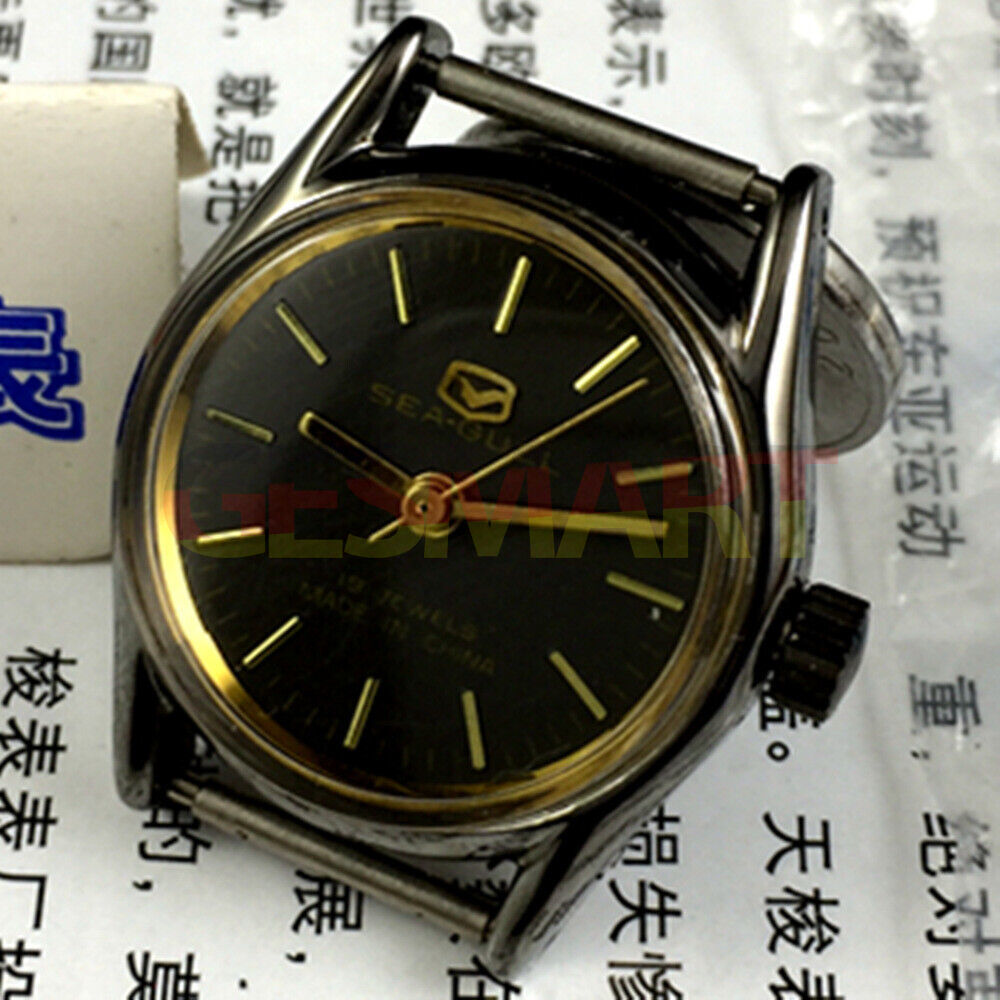Tianjin Seagull 27mm ladies watch with gold case, black dial, manual mechanical movement, elegant style.