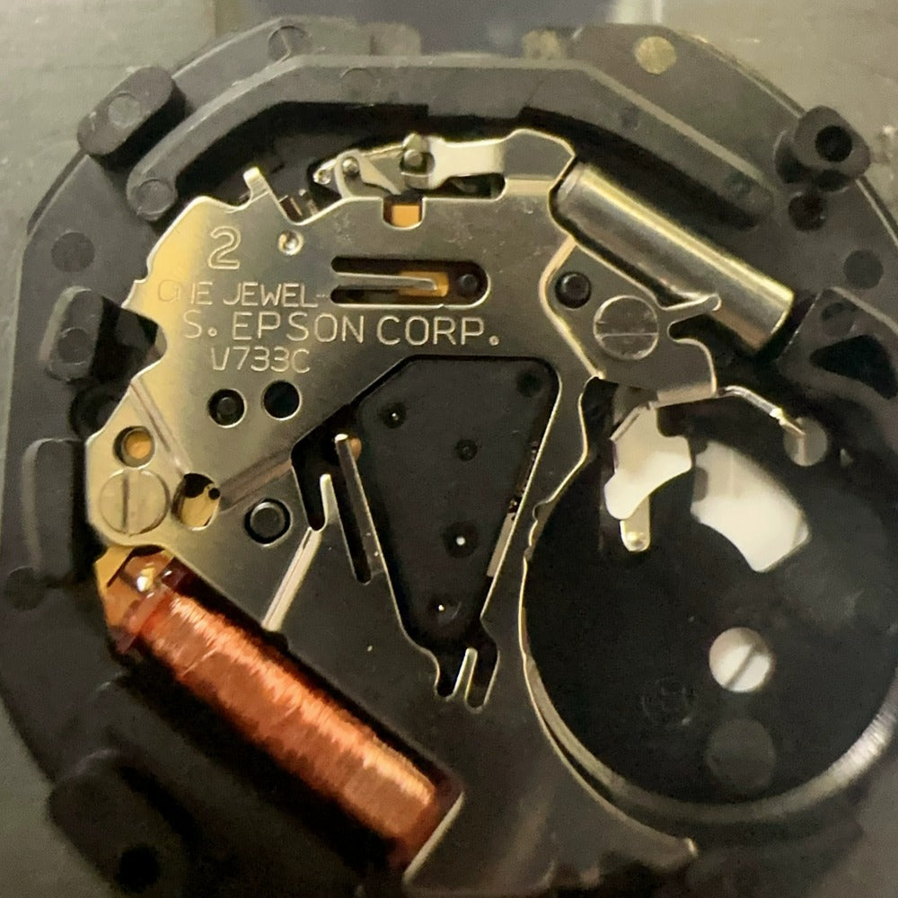 Epson V733C quartz day-date watch part, genuine Japan-made replacement for precise timekeeping.