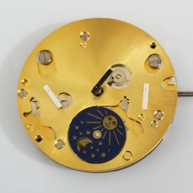 Gold quartz watch repair parts from ISA 9231, compatible with various watch models.