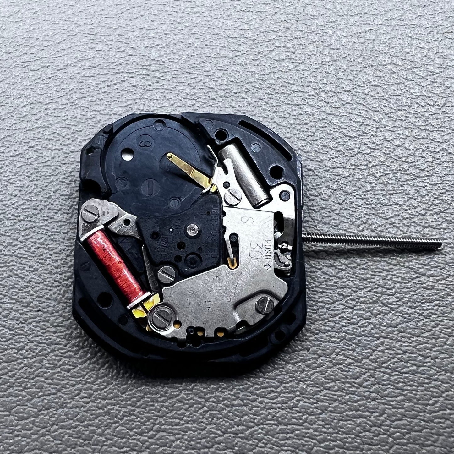 Japan VX22 quartz watch movement with date at 3 o'clock, white disk replacement for precision.