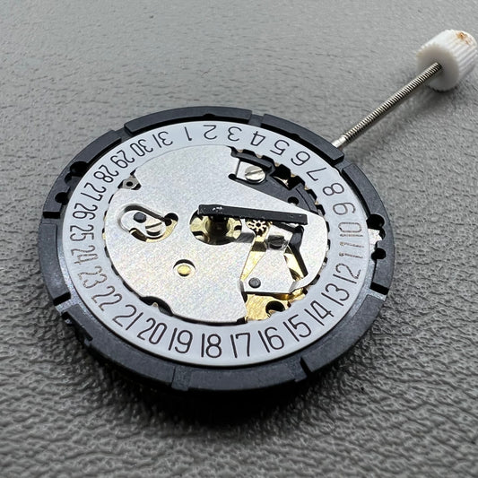 Swiss ISA 338 quartz watch movement with date at 6 o'clock and three hands, ideal for watch accessories.