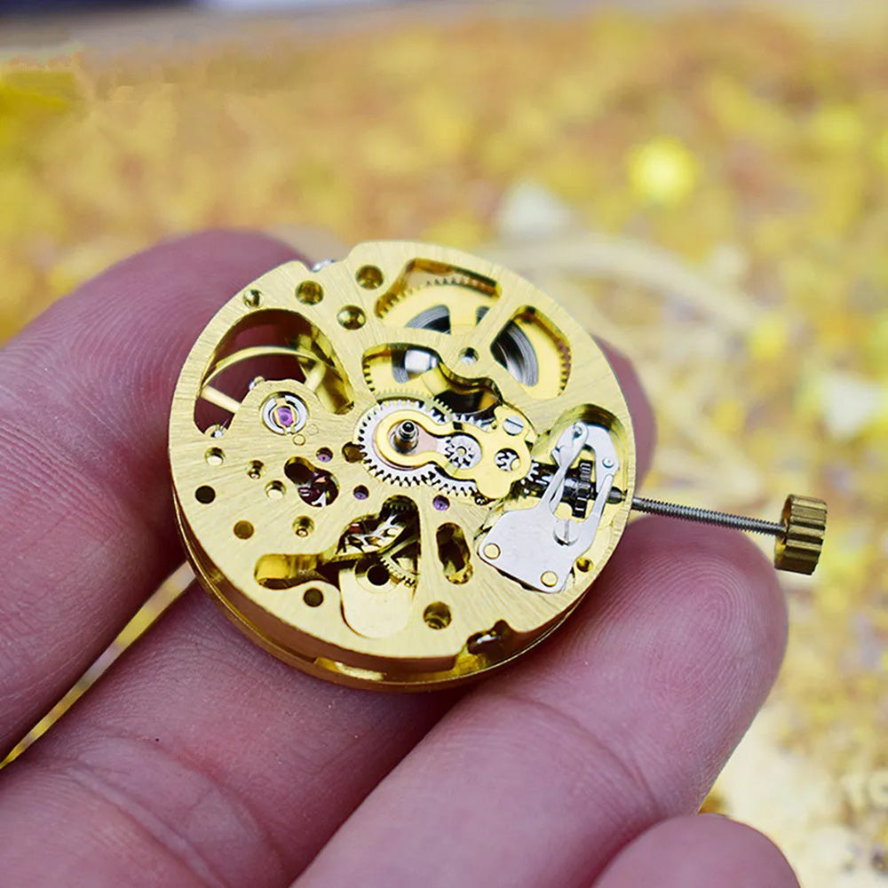 Gold 27mm 17-jewel skeleton automatic watch movement with pendulum adjustment by Radiation Pattern, 2004 model.