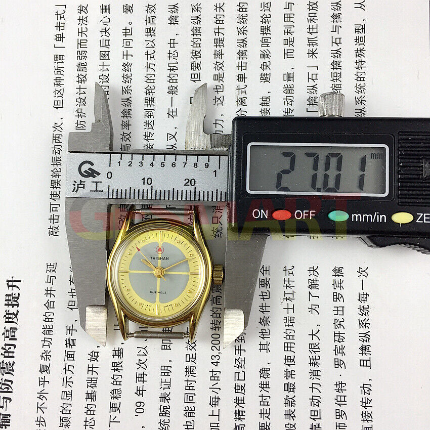 TAISHAN mechanical lady watch with 19 jewels, yellow-grey dial, and golden round case for classic elegance.