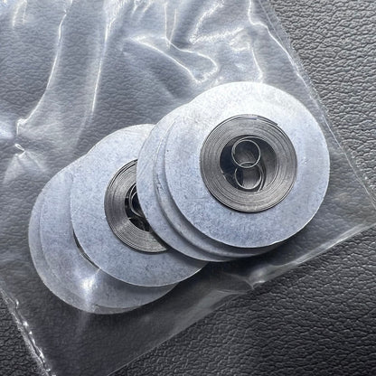 Silver mainspring set for movement 7009#180, generic fit, 5 pieces for precise watch repair.