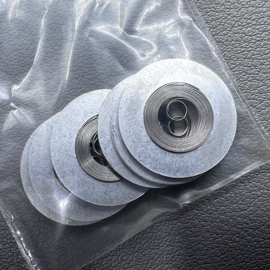 Silver mainspring set for movement 7009#180, generic fit, 5 pieces for precise watch repair.