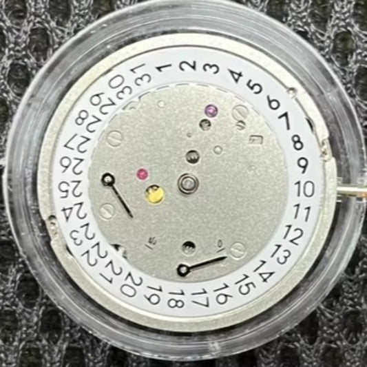 ETA 7750 automatic chronograph movement with day-date at 3 o'clock, precision watch mechanism.