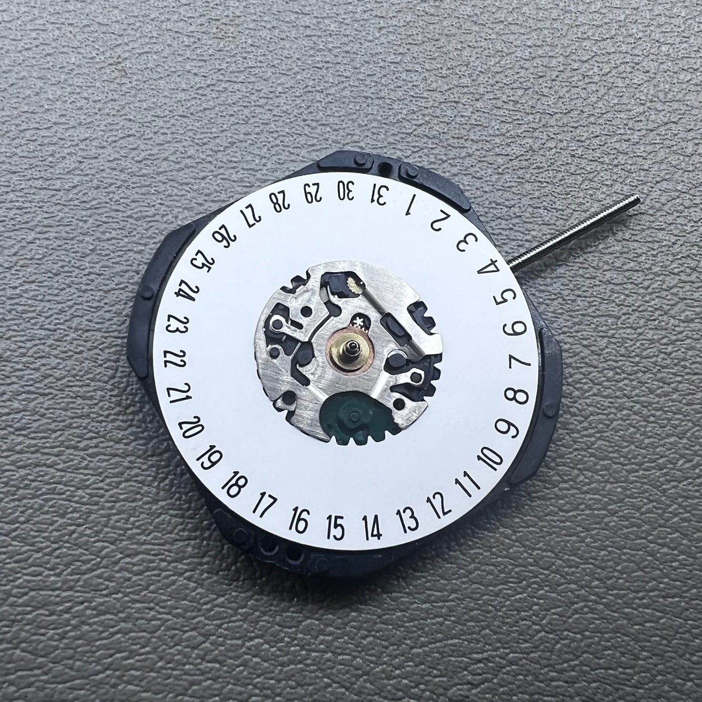Japan Hattori Epson VX42E quartz watch movement with date display at 6 o'clock, precision timing.