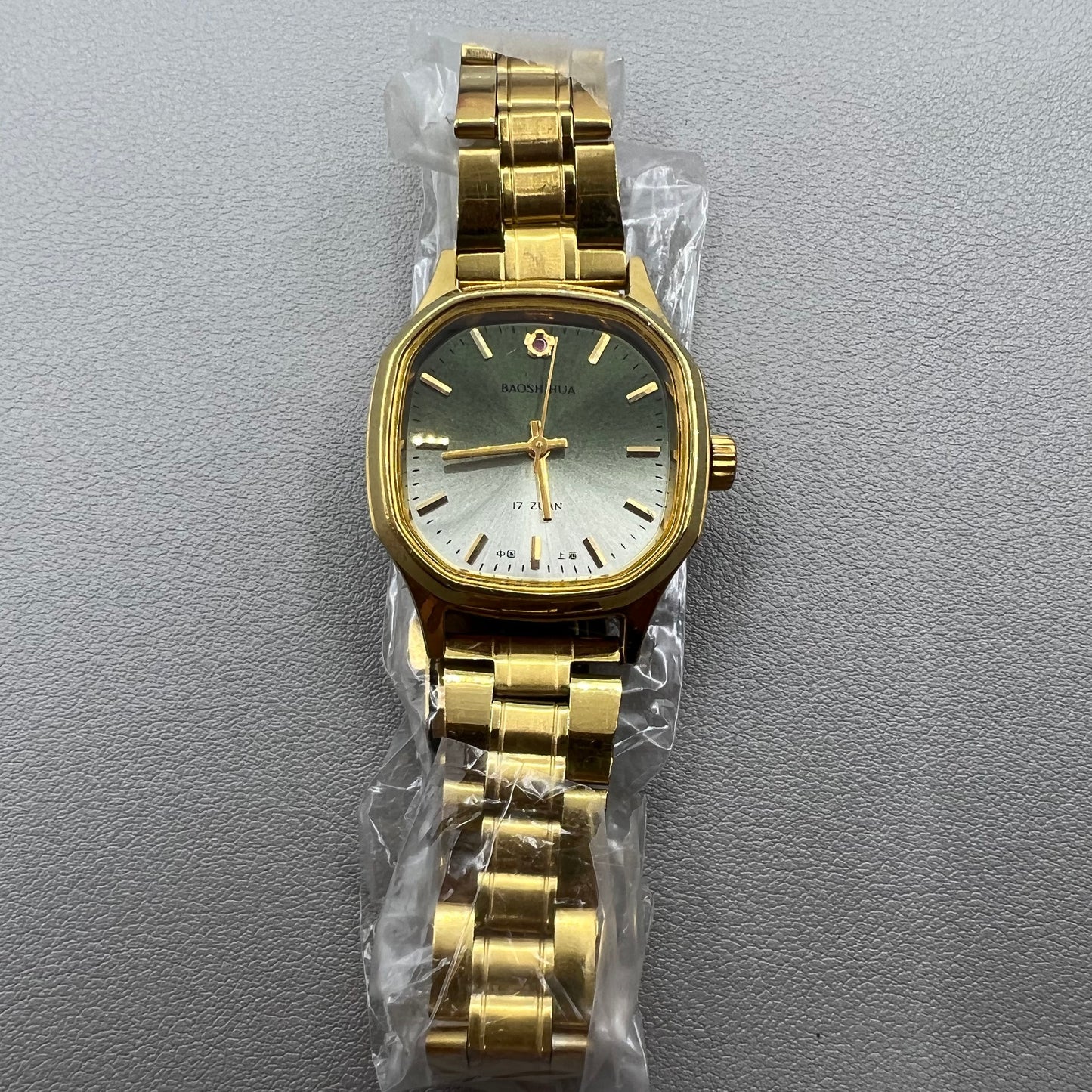Shanghai 33mm manual mechanical watch with golden nail square case, 17 jewels, elegant design.