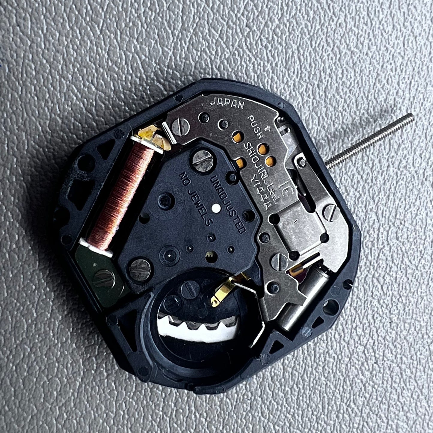 Japan Yl44A quartz watch movement with 3 hands, double calendar, and golden disk detail.