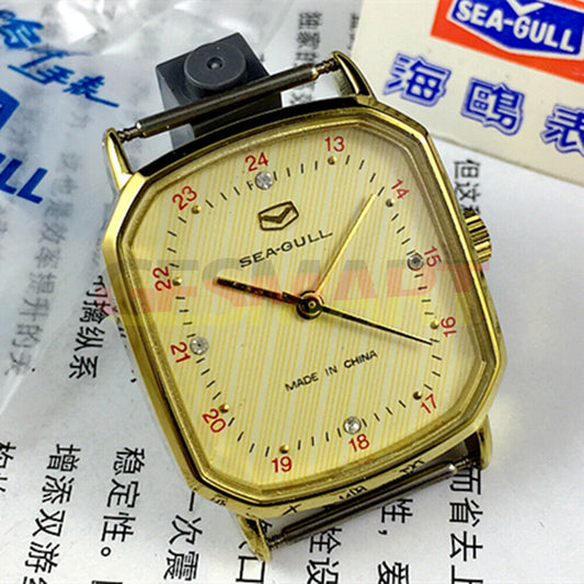 Seagull 28mm ladies watch with golden square case and nail markers, manual mechanical movement.