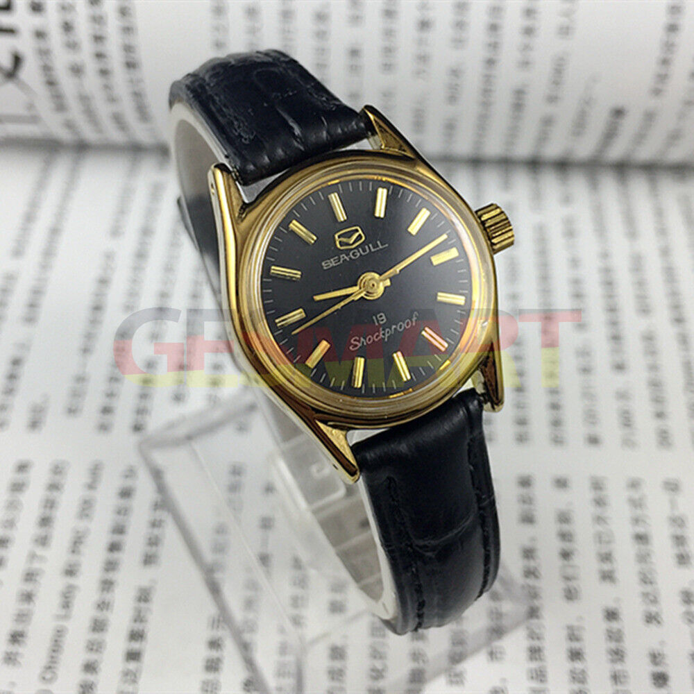 Black round case Tianjin Seagull ladies watch with gold nail markers and manual mechanical movement.