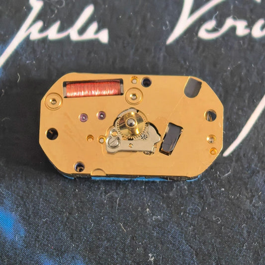 Close-up of Swiss Made ETA280.702 quartz movement watch part for accurate timekeeping.