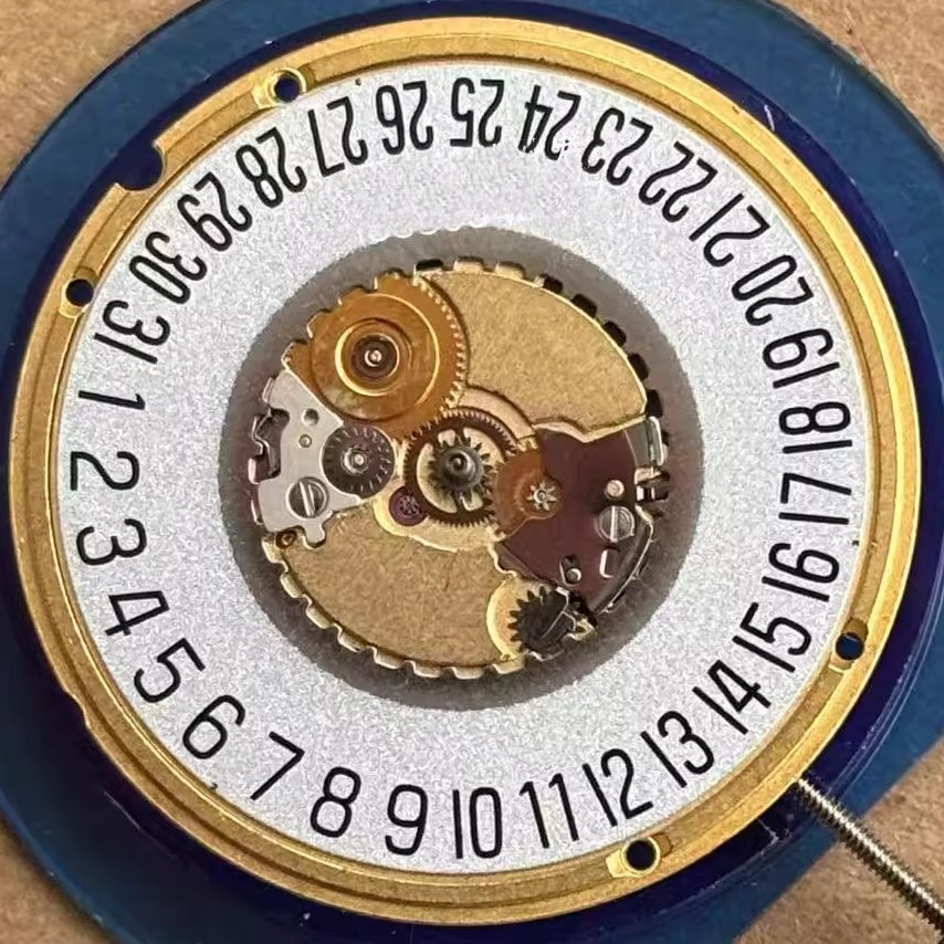 Swiss made ETA955.112 quartz watch movement with 3 hands and white date disk at 6 o'clock