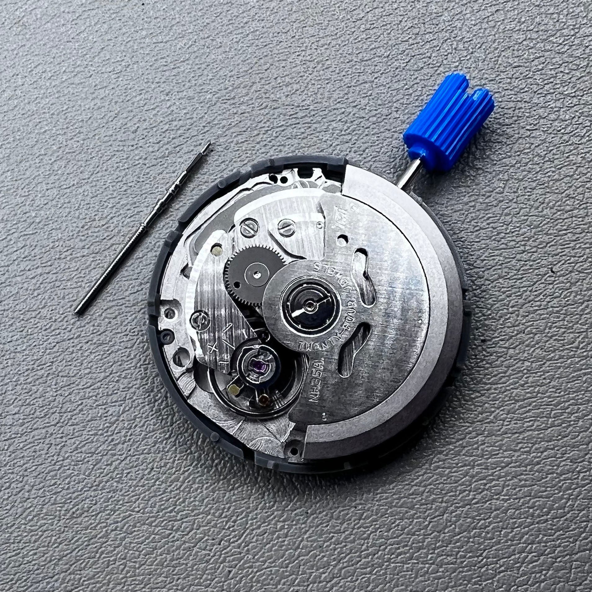 Seiko NH35A watch movement with black dial, 24 jewels, and date display at 6 o'clock for watch repairs.