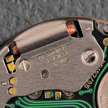 Swiss ISA 8171A quartz watch movement with 6 hands and white date disk at 4 o'clock, perfect for precise watch repairs.
