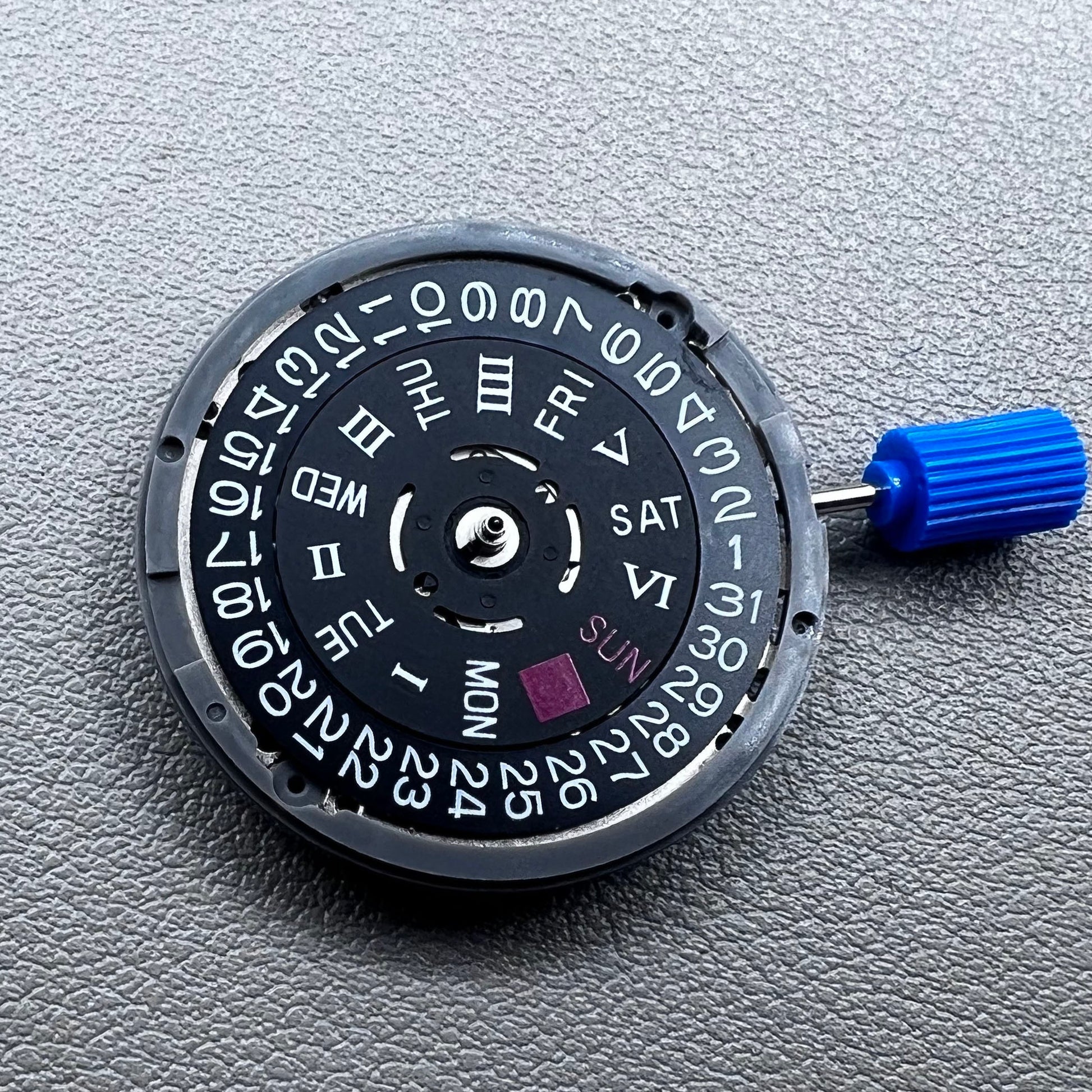 Seiko NH36A automatic movement with black Roman wheel crown, precise watch accessory for mechanical timepieces.