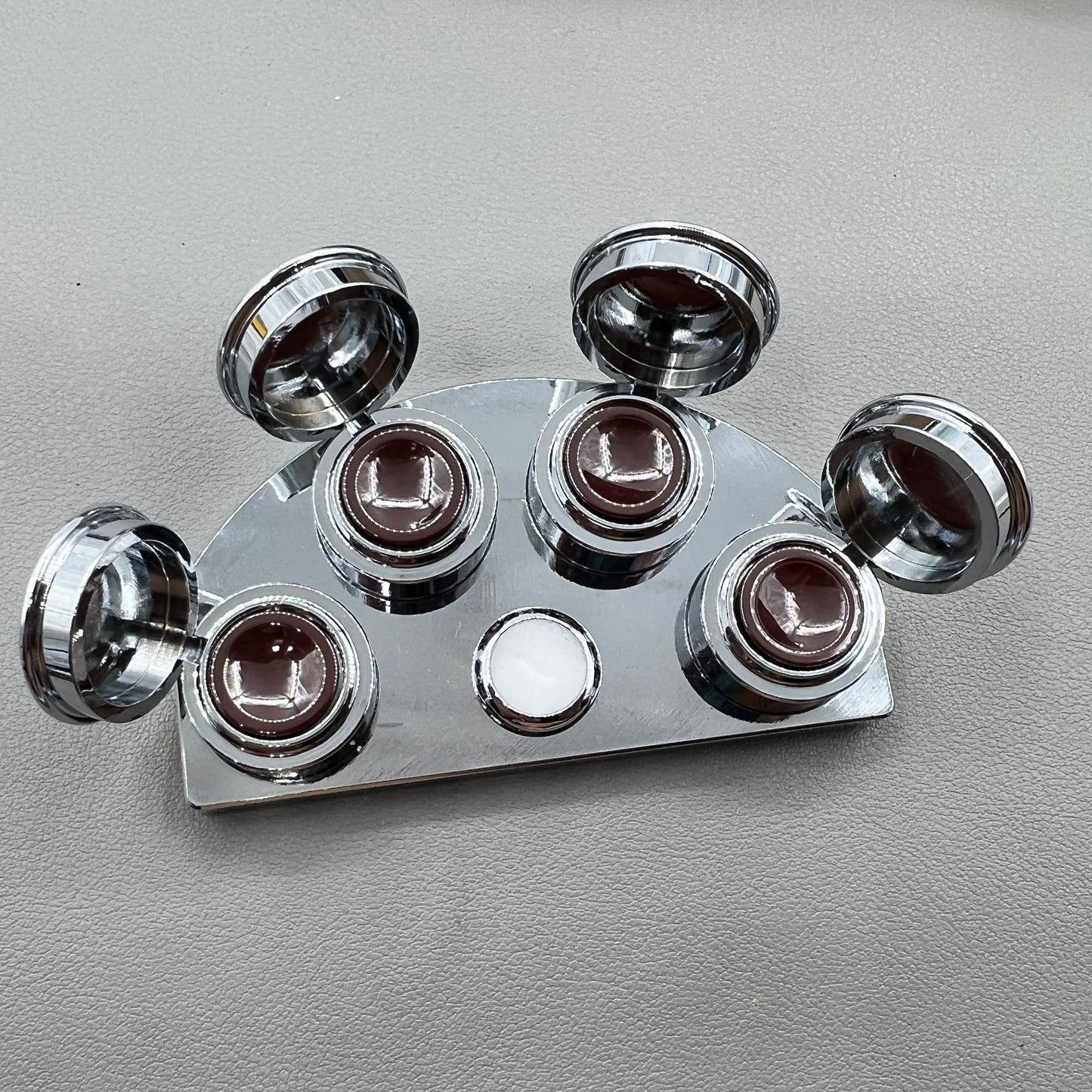 BG 30180-A stainless steel watch oil cup stand with 4 covered oiler dishes for precise watch repair.