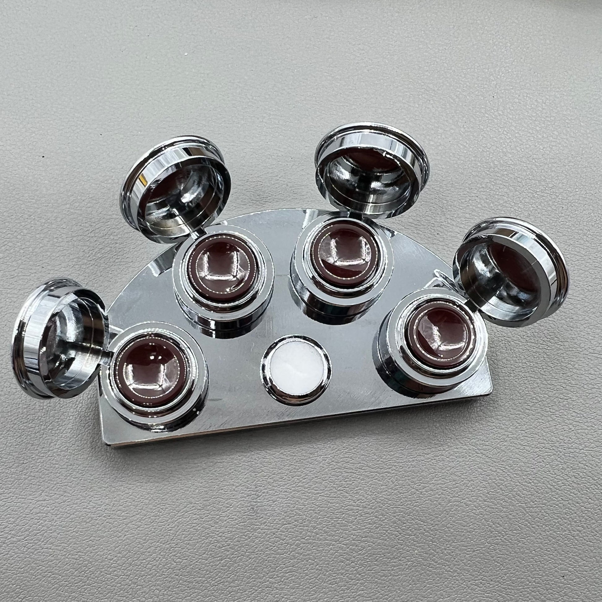 BG 30180-A stainless steel watch oil cup stand with 4 covered oiler dishes for precise watch repair.