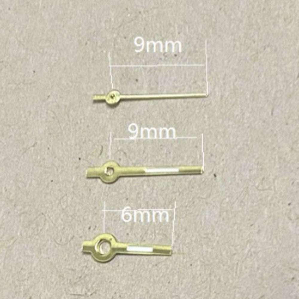 Golden trim green lume arrow watch hands for Miyota 2035, precise fit and luminous visibility.