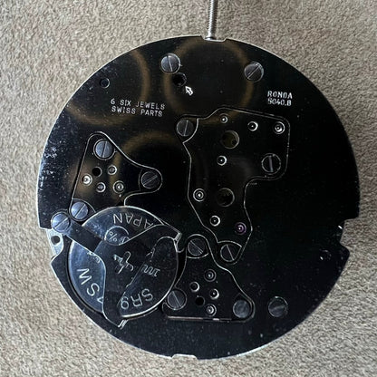 Swiss Part 5040.B Quartz movement watch component with date display at 12, ideal for precise repairs.