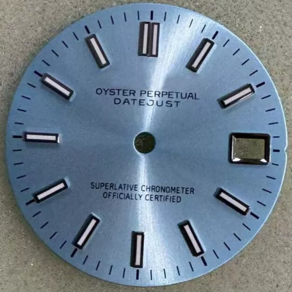 Light blue dial with silver trim and green lume for NH35 watch movement.