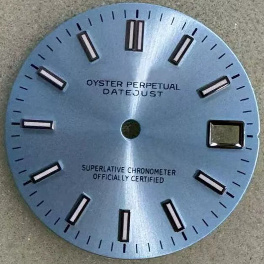 Light blue dial with silver trim and green lume for NH35 watch movement.