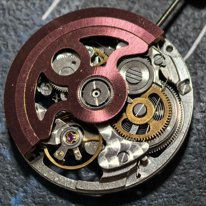 Hollow Hangzhou 2189 automatic watch movement with red rotor and three hands, China made for precision.