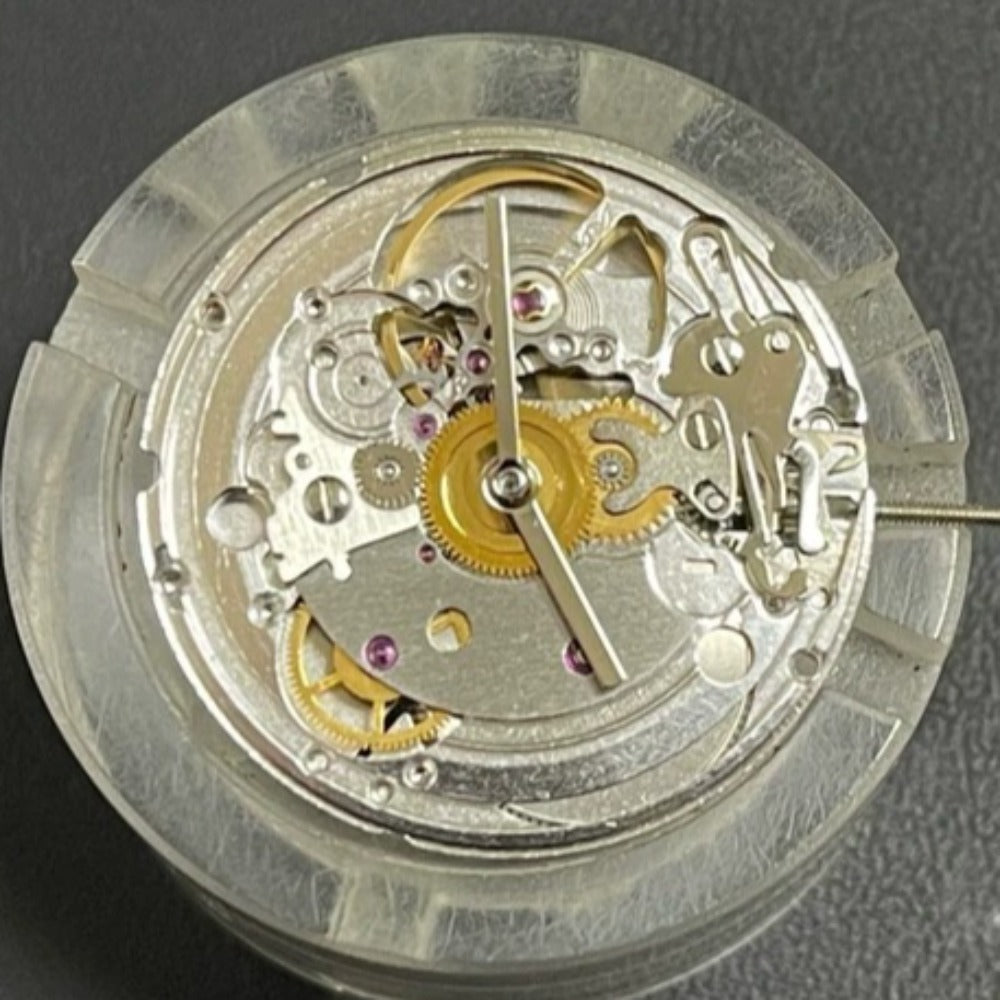 Automatic chronograph watch movement with day-date at 3 o'clock, Asian 7750 caliber ETA configuration.