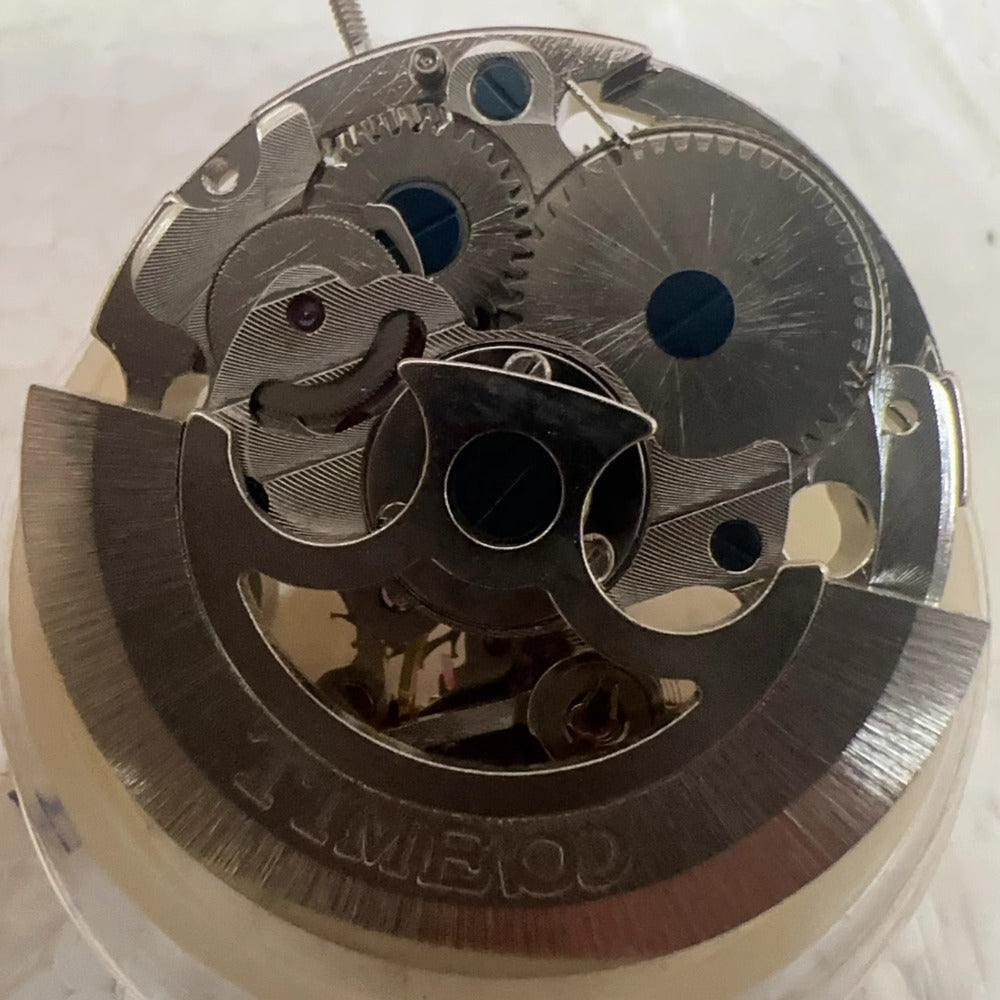 Dandong 7120 mechanical movement watch part showcasing intricate hollow design for precision timepieces.