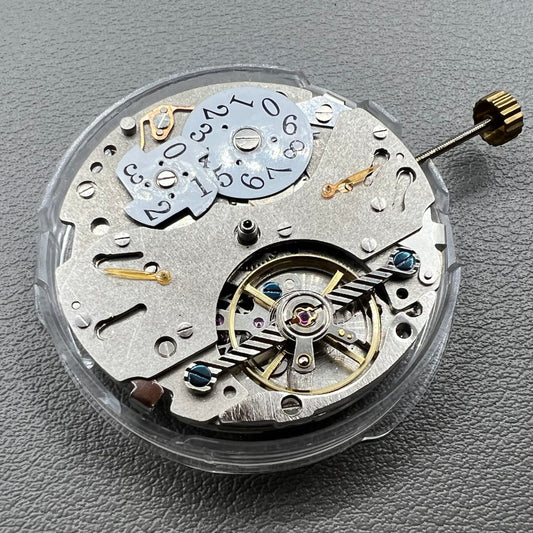 Wenzhou Mechanical watch movement with bare balance wheel and big date display at 12 o'clock.
