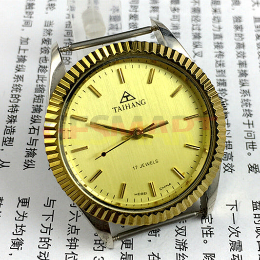 38mm TAIHANG manual mechanical watch with golden dial, nail markers, round case, 17 jewels.