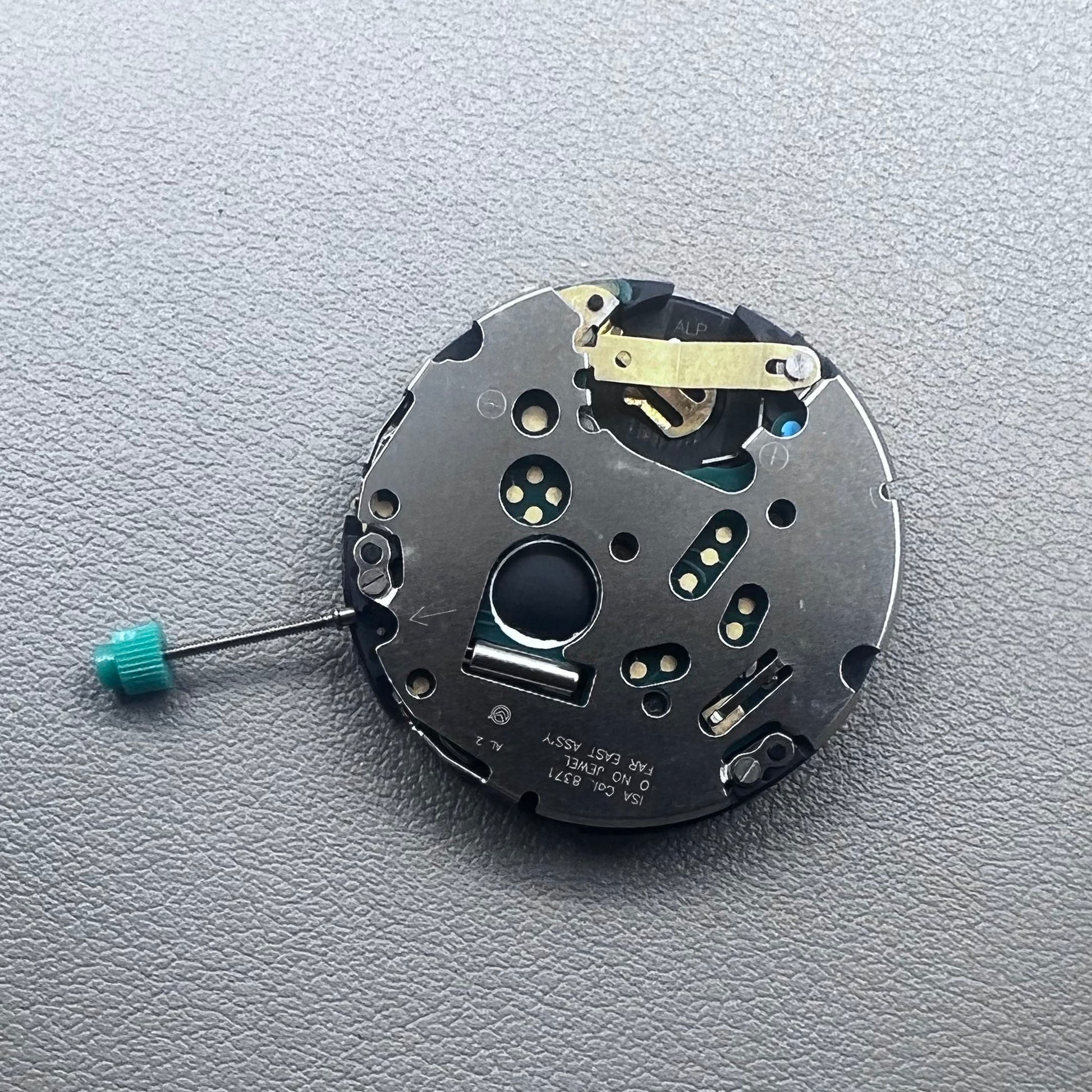 Swiss ISA 8371C quartz movement by ISA, multifunctional watch mechanism for precise timekeeping.
