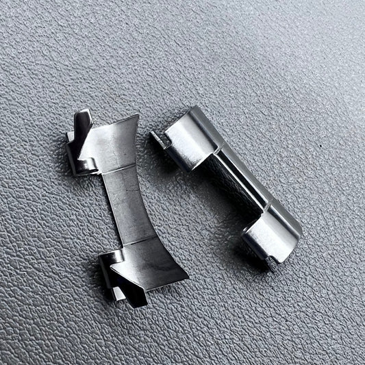 Set of 2 stainless steel 20x9mm curved end links and spring bars for watch bands, compatible with various straps.