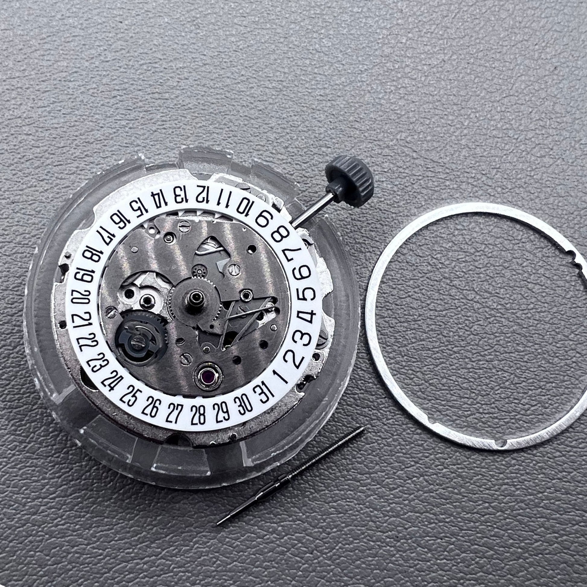 Japan Miyota 8215 silver plated automatic watch movement with date at 6 o?clock, precise mechanical design.