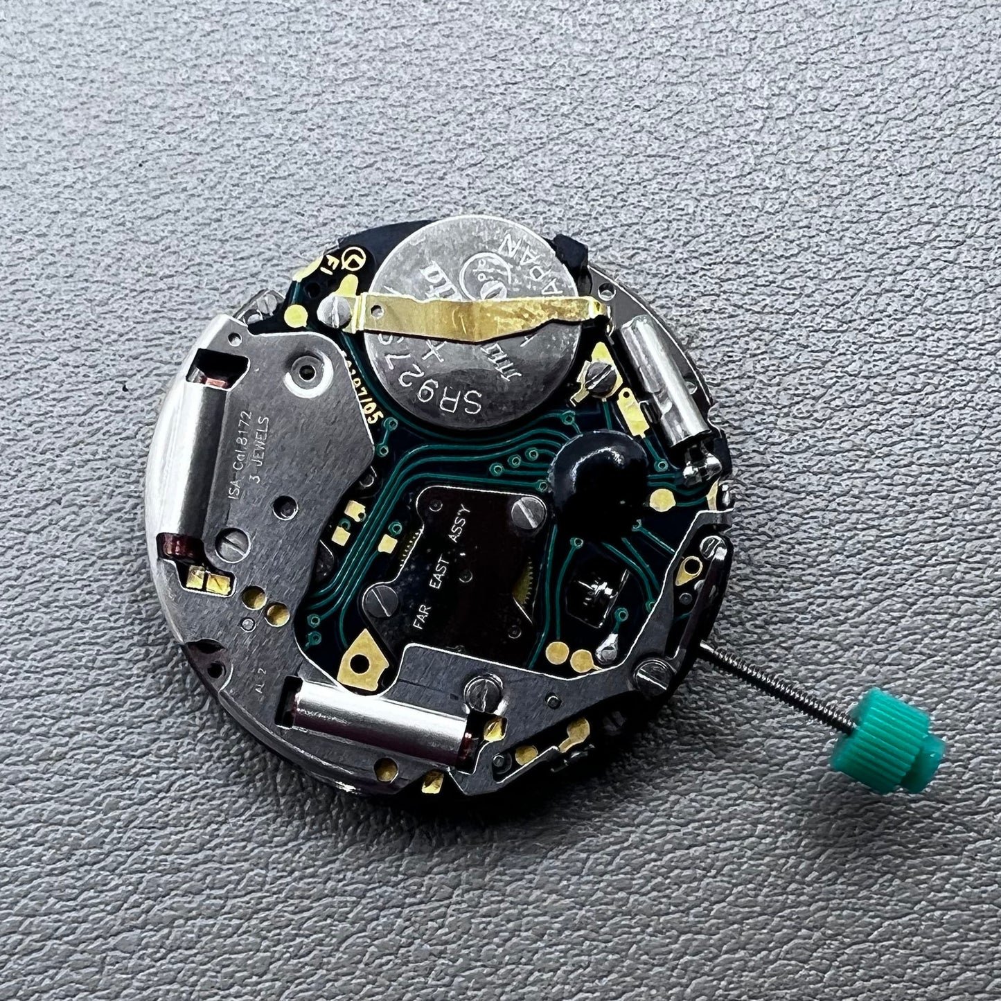 Swiss ISA 8172 silver plated quartz watch movement with stem, precise timekeeping for watch repair and assembly.